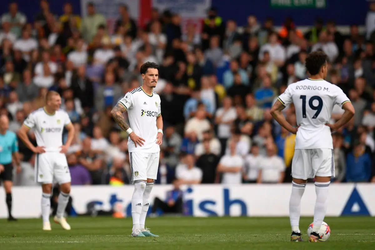 Leeds United's Rasmus Kristensen and Robin Koch (C) and Rodrigo (R) react after conceding against Tottenham Hotspur. 
