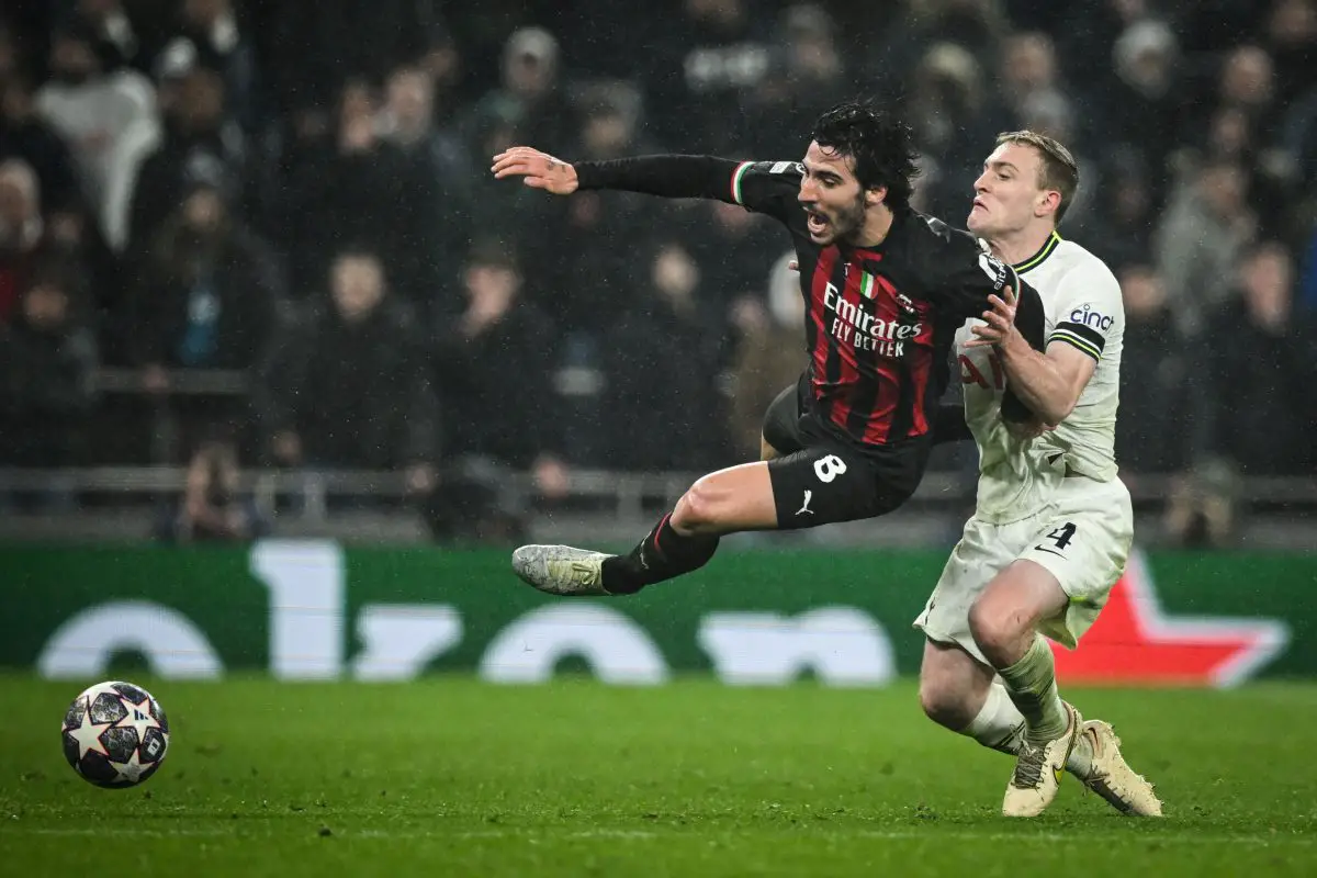 AC Milan's Italian midfielder Sandro Tonali (L) fights for the ball with Tottenham Hotspur's English midfielder Oliver Skipp. (Photo by JUSTIN TALLIS/AFP via Getty Images)