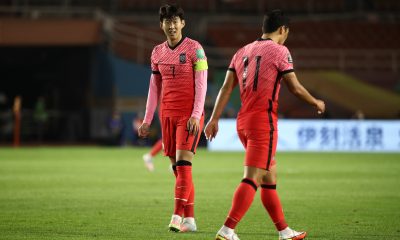 Son Heung-Min of South Korea talks with Hwang Hee-Chan.