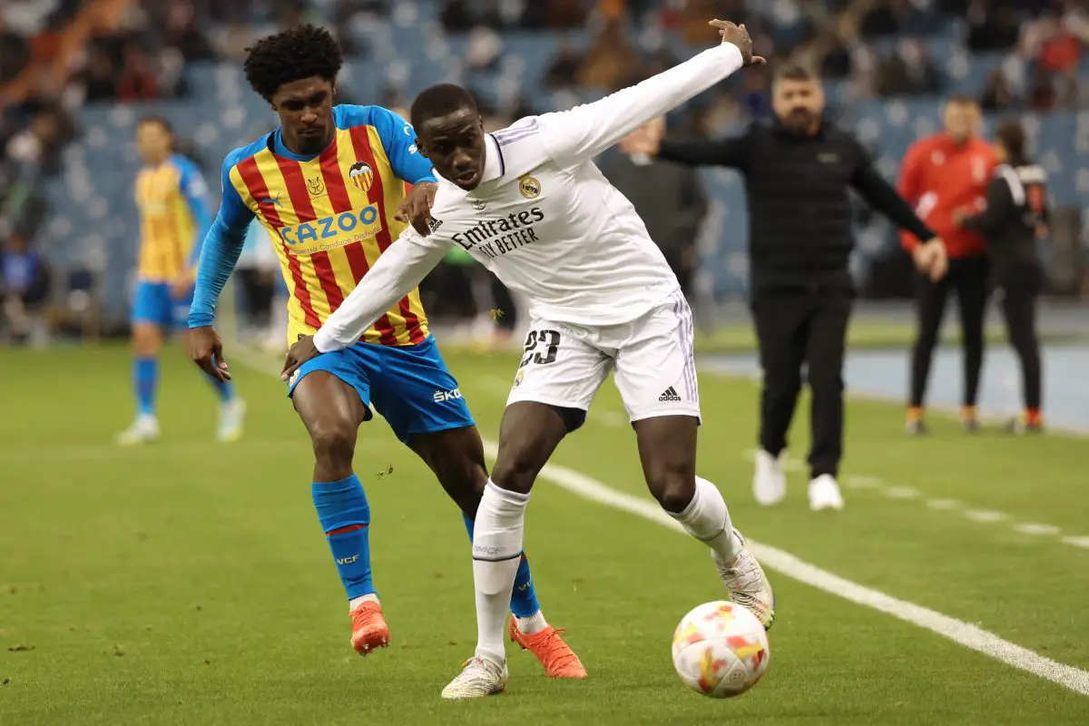 Real Madrid's French defender Ferland Mendy vies with Valencia's Portuguese defender Thierry Correia.