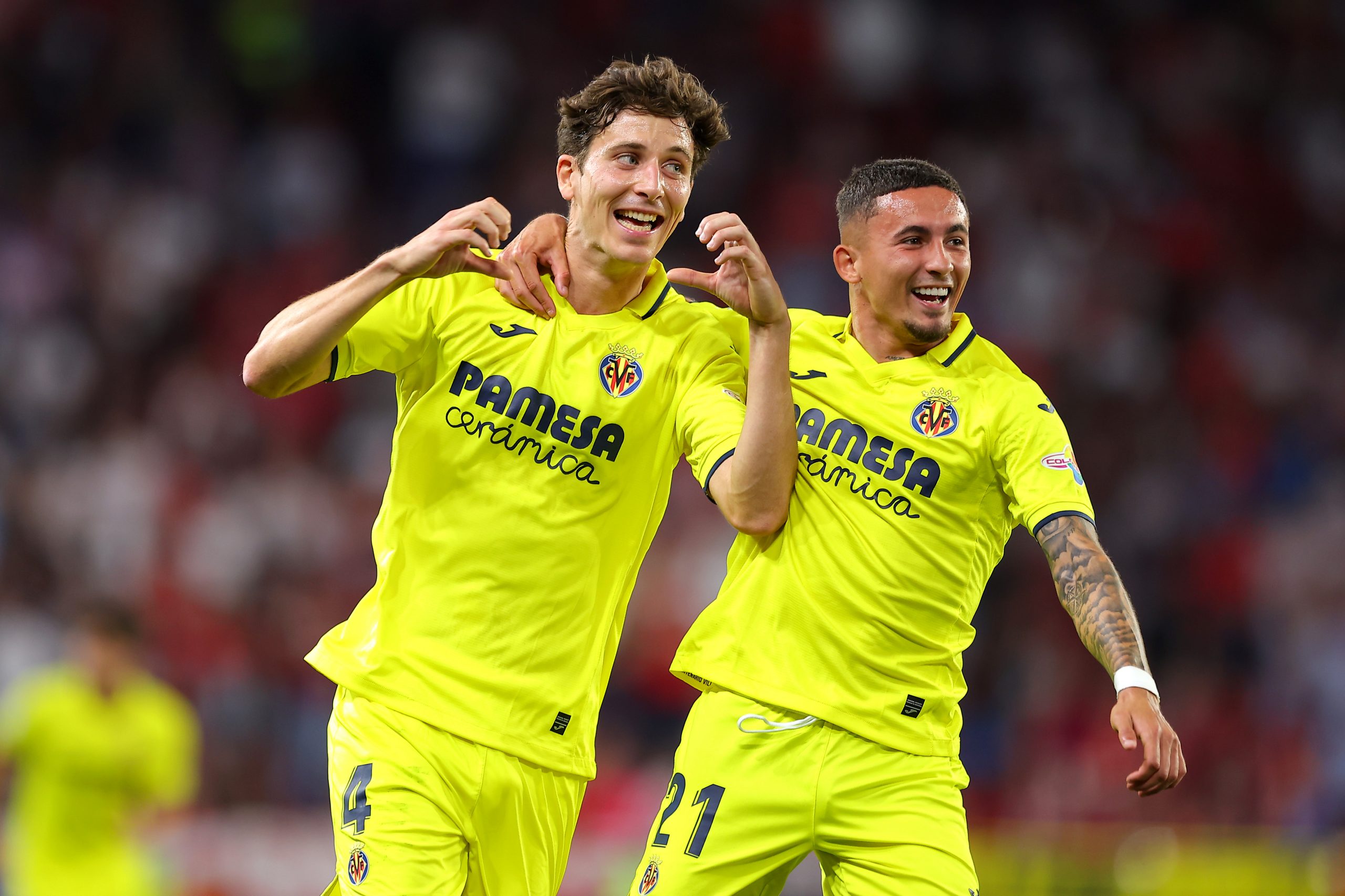 Pau Torres of Villarreal CF celebrates with teammate Yeremi Pino.