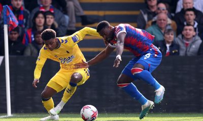 emarai Gray is challenged by Marc Guehi of Crystal Palace.