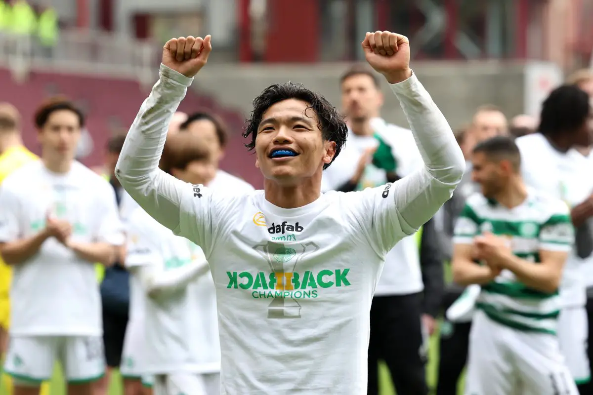 Reo Hatate of Celtic celebrates after winning the Cinch Scottish Premiership. 