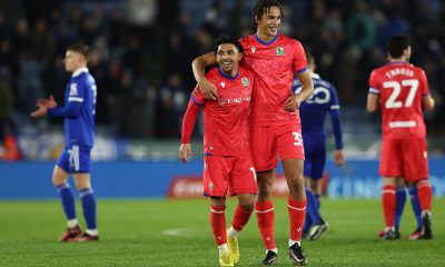 Blackburn Rovers' English midfielder Tyrhys Dolan (C) and Ashley Phillips celebrate.