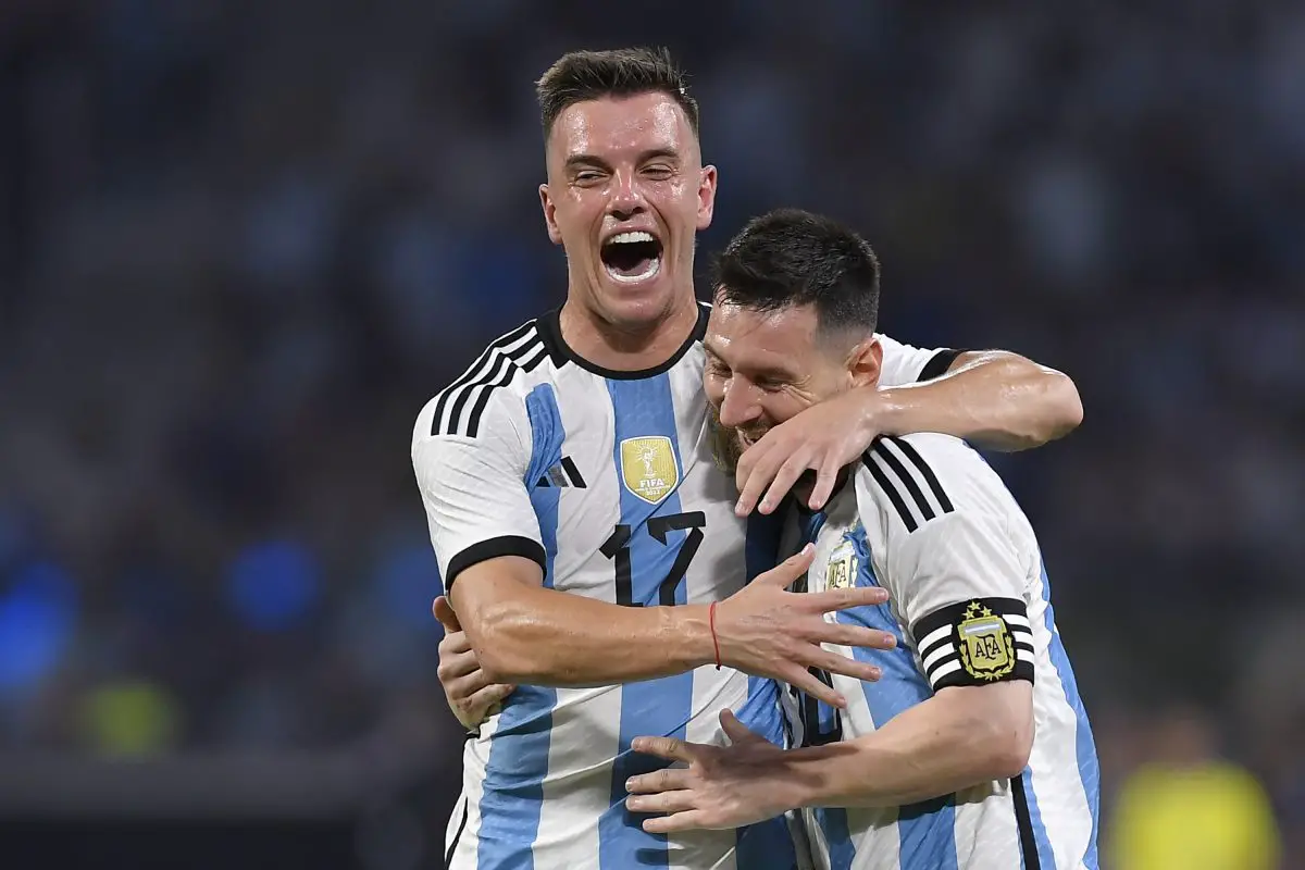 Lionel Messi of Argentina celebrates with teammate Giovani Lo Celso.