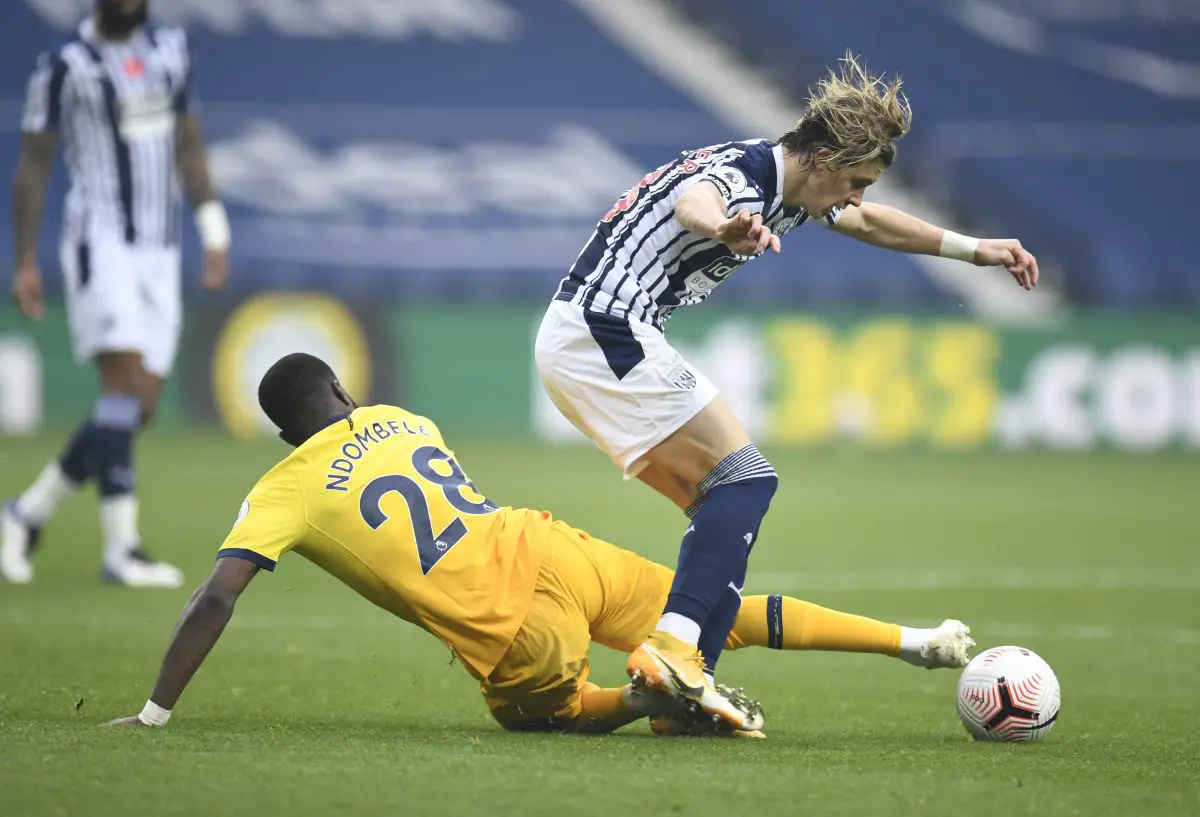 Conor Gallagher of West Bromwich Albion is tackled by Tanguy N'dombele of Tottenham Hotspur. 
