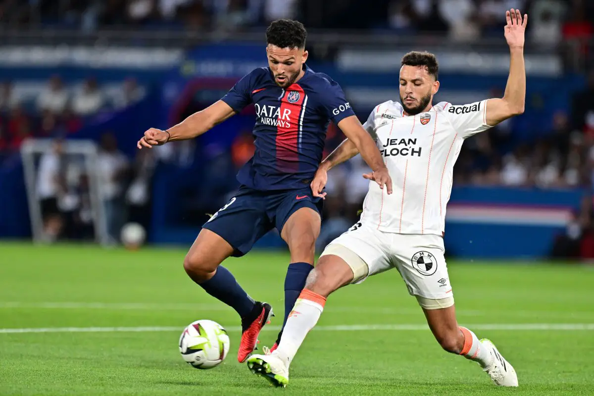 Lorient's Tunisian defender Montassar Talbi (R) fights for the ball with Paris Saint-Germain's Portuguese forward Goncalo Ramos. (Photo by MIGUEL MEDINA/AFP via Getty Images)