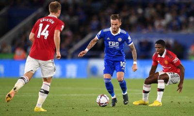 James Maddison of Leicester City is challenged by Christian Eriksen and Tyrell Malacia of Manchester United.