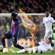 Barcelona's Ivorian midfielder Franck Kessie (L) fights for the ball with Real Madrid's German midfielder Toni Kroos.