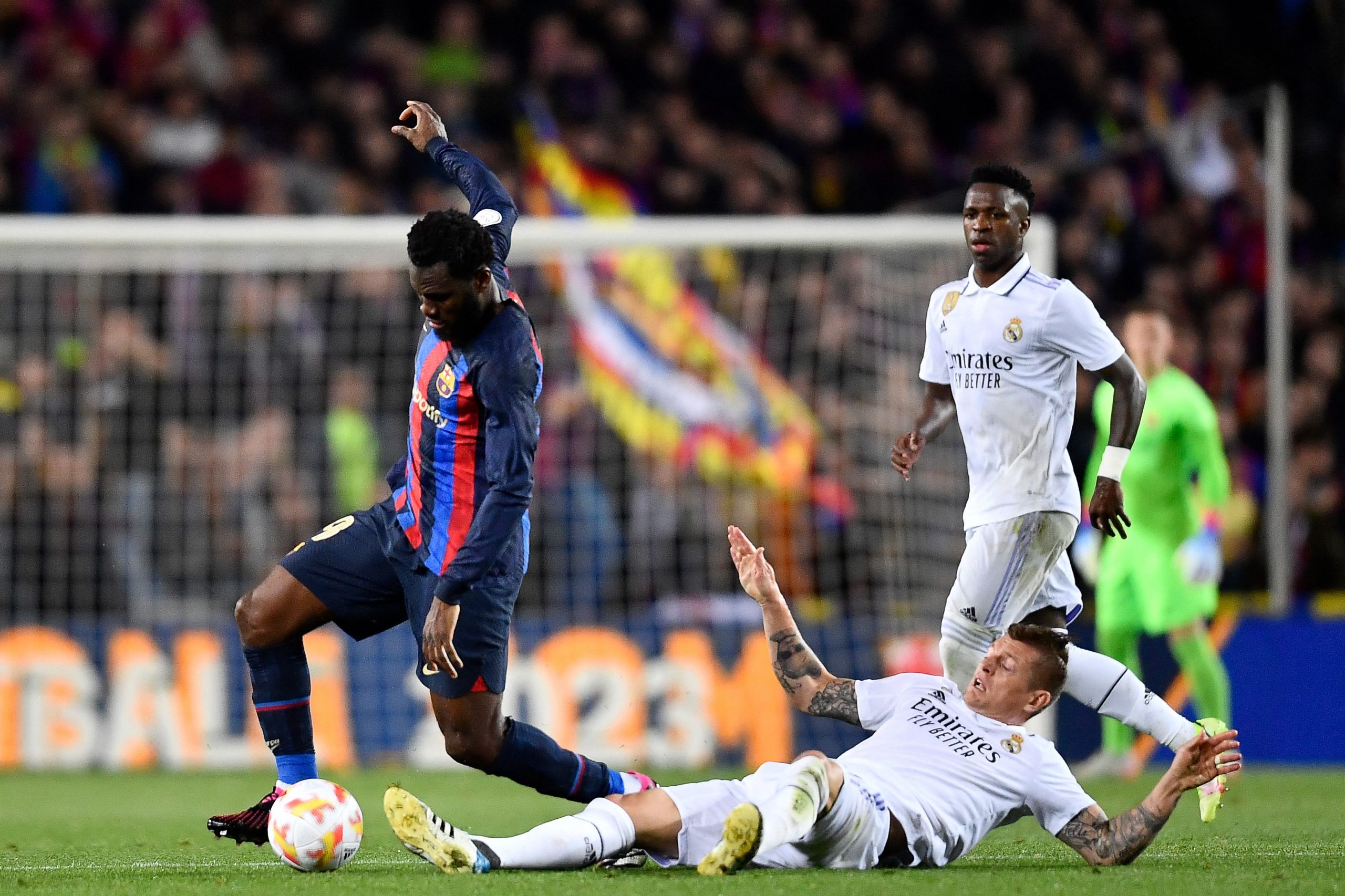 Barcelona's Ivorian midfielder Franck Kessie (L) fights for the ball with Real Madrid's German midfielder Toni Kroos.
