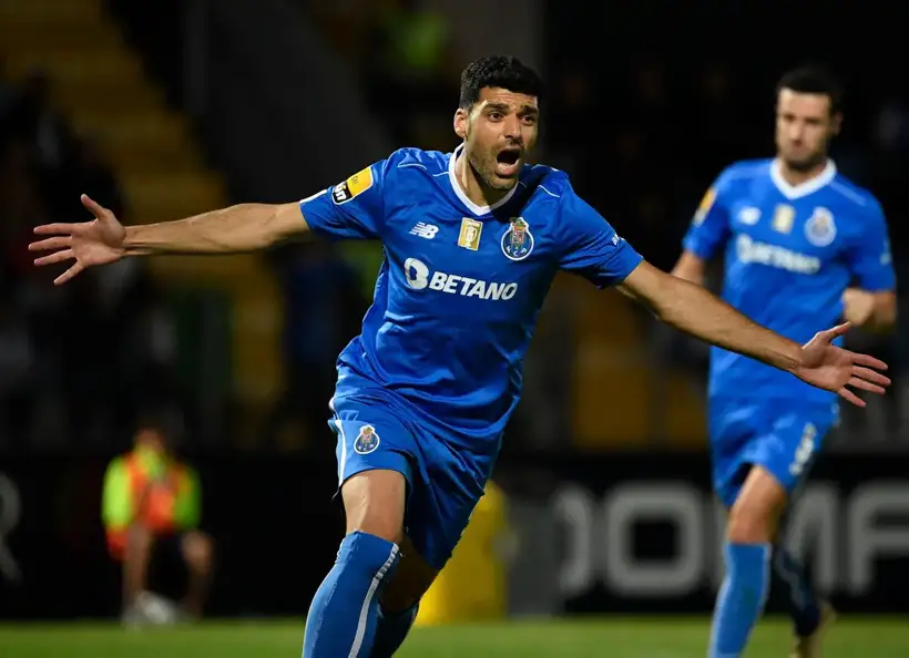 FC Porto's Iranian forward Mehdi Taremi celebrates after scoring his team's third goal during the Portuguese league football match between FC Famalicao and FC Porto at the Estadio Municipal 22 de Junho in Vila Nova de Famalicao on May 20, 2023