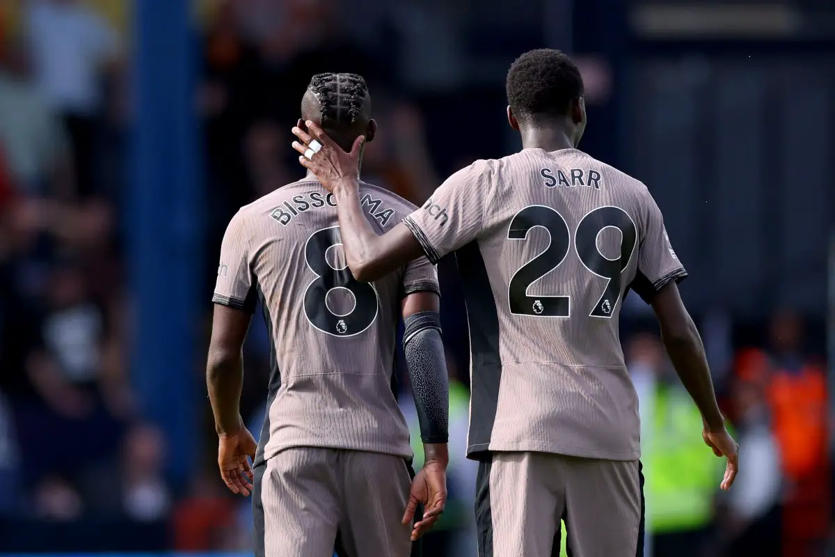 Yves Bissouma of Tottenham Hotspur is consoled by teammate Pape Matar Sarr as he leaves the pitch after being shown a red card against Luton Town. (Photo by Marc Atkins/Getty Images)