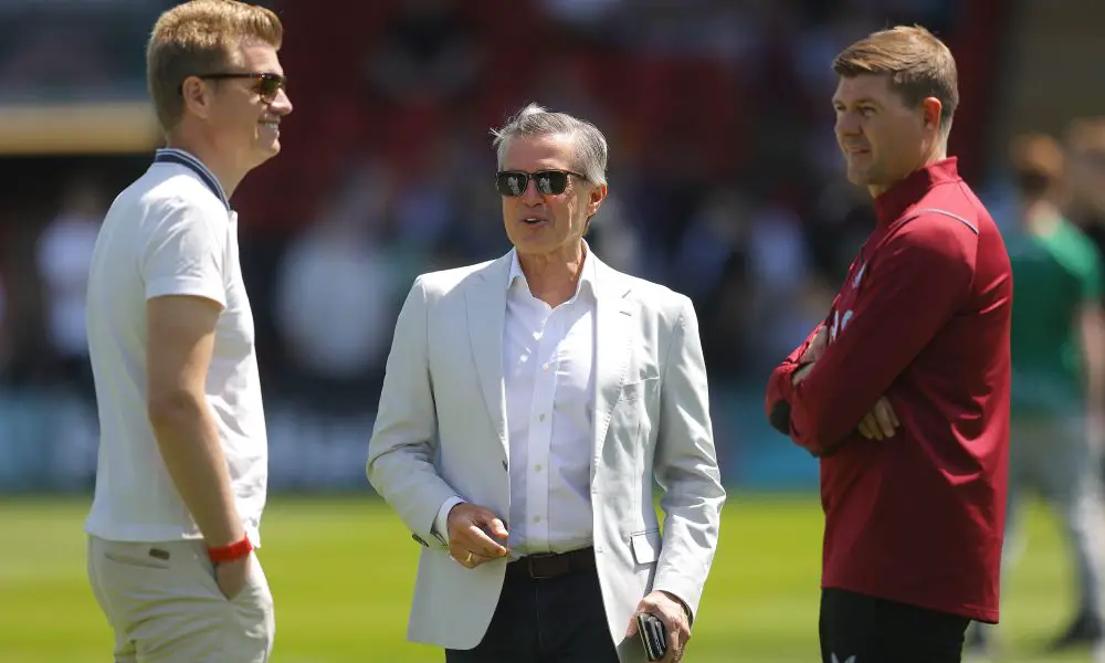Aston Villa Chief Executive Christian Purslow (C) chats to Sporting Director Johan Lange (L) and manager Steven Gerrard (R).