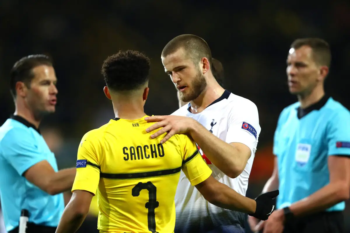  Eric Dier of Tottenham Hotspur and Jadon Sancho of Borussia Dortmund hug. (Photo by Dean Mouhtaropoulos/Getty Images)