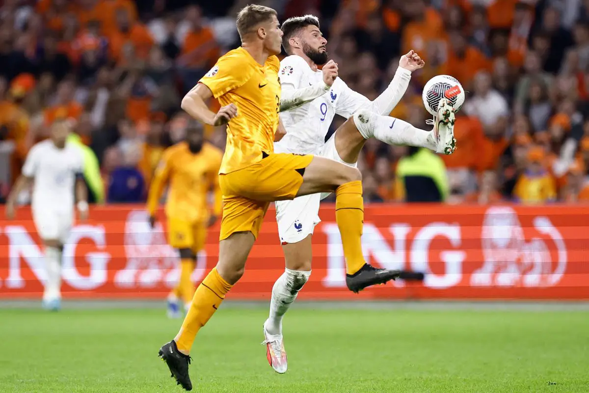 France's forward Olivier Giroud (R) fights for the ball with Netherland's defender Micky van de Ven. (Photo by KENZO TRIBOUILLARD/AFP via Getty Images)