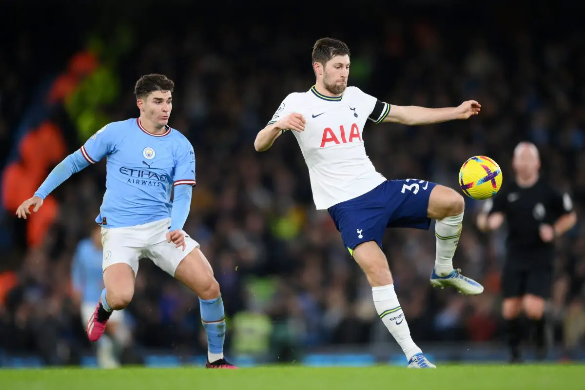 Ben Davies of Tottenham Hotspur controls the ball whilst under pressure from Julian Alvarez of Manchester City.