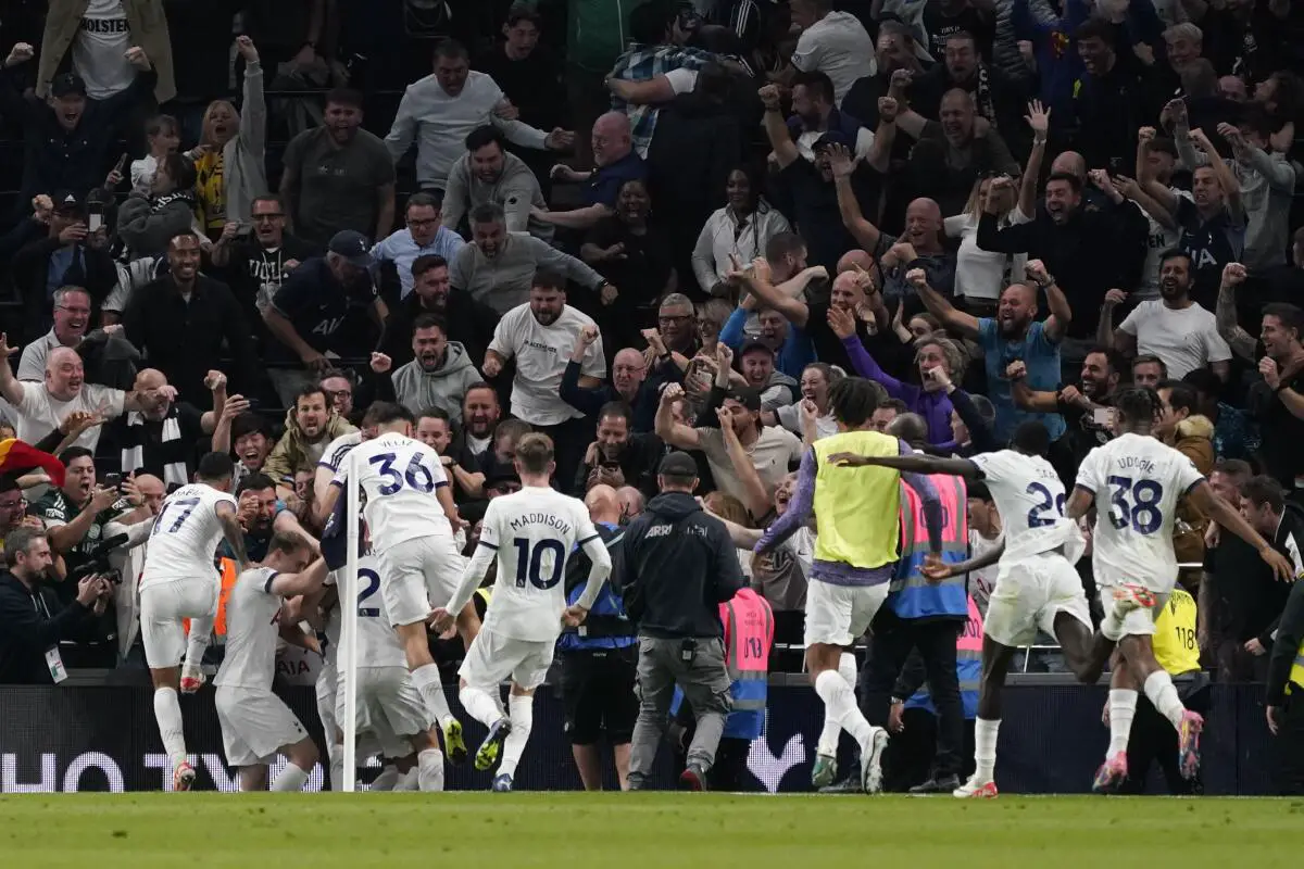 Tottenham Hotspur players celebrate their late goal vs Liverpool 