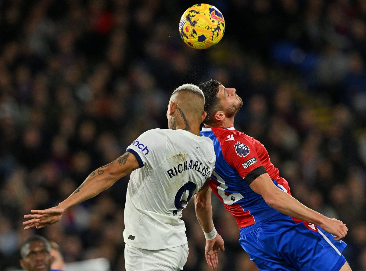 Tottenham Hotspur's Richarlison (L) and Crystal Palace's Joel Ward vie to head the ball. (Photo by GLYN KIRK/AFP via Getty Images)