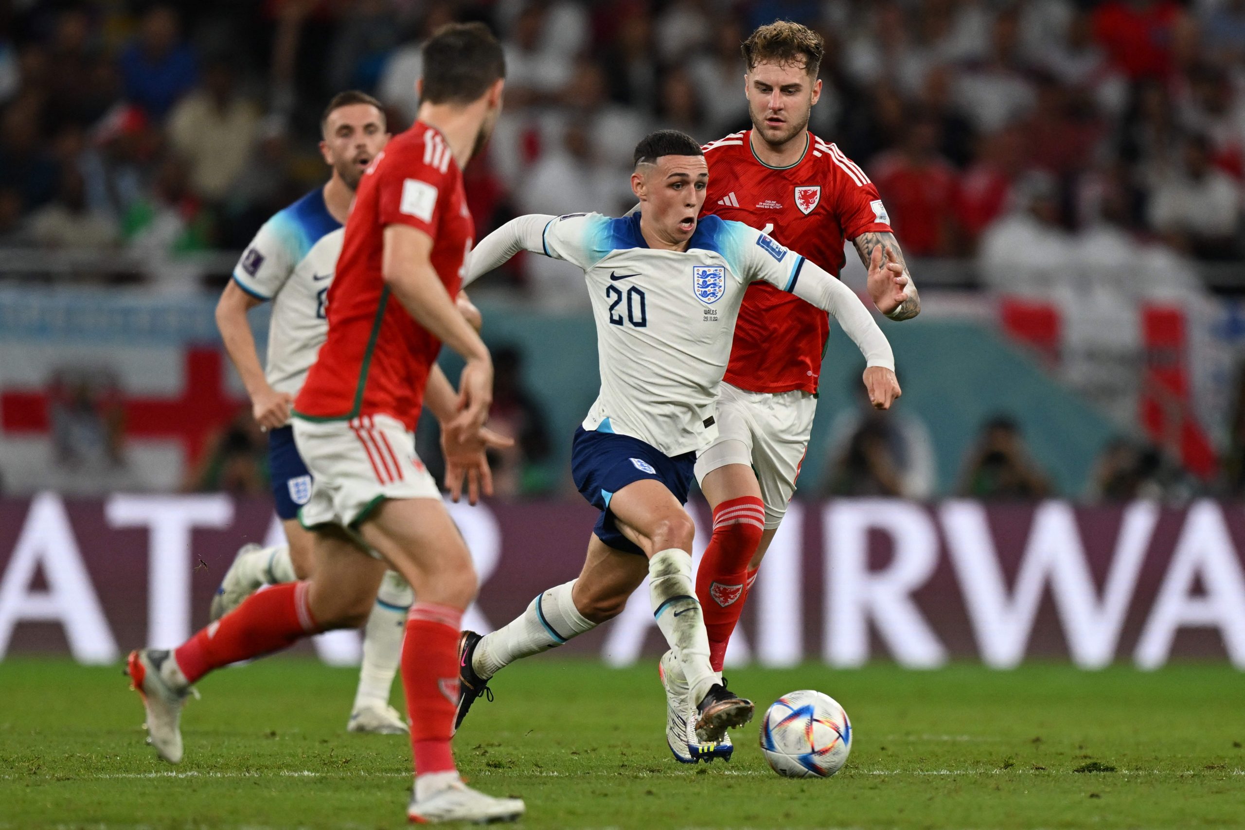 England's forward Phil Foden is marked by Wales' defenders Joe Rodon and Ben Davies. (Photo by ANDREJ ISAKOVIC/AFP via Getty Images)