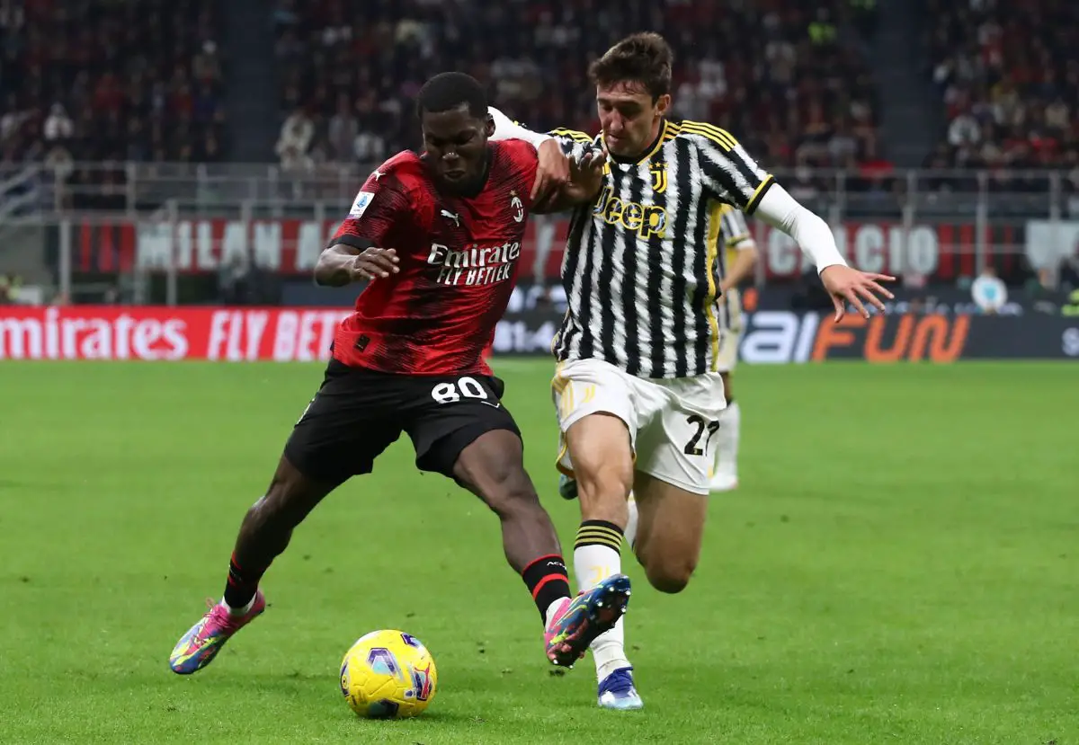 Yunus Musah of AC Milan battles for possession with Andrea Cambiaso of Juventus FC. (Photo by Marco Luzzani/Getty Images)